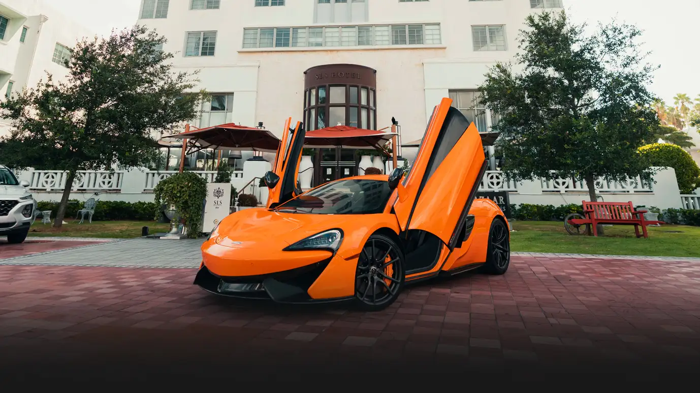 Orange McLaren 570s rental profile view mph club
