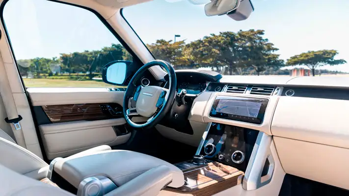 Red Range Rover rental Miami dashboard view mph club