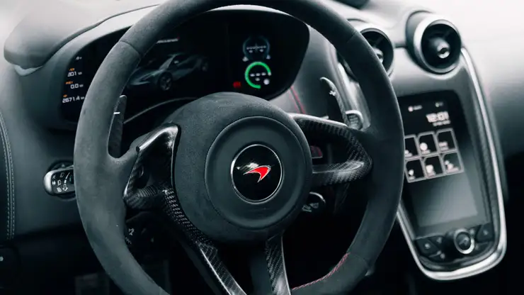 White McLaren 570s rental dashboard view mph club