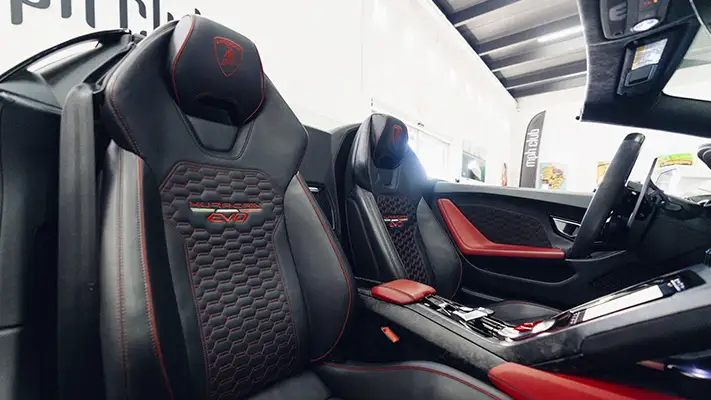 White on red Lamborghini Huracan EVO Spyder rental interior view - mph club