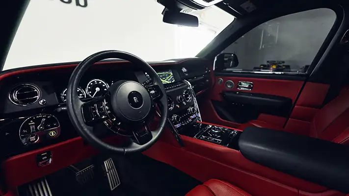 Black on red Rolls Royce Cullinan rental dashboard view - mph club