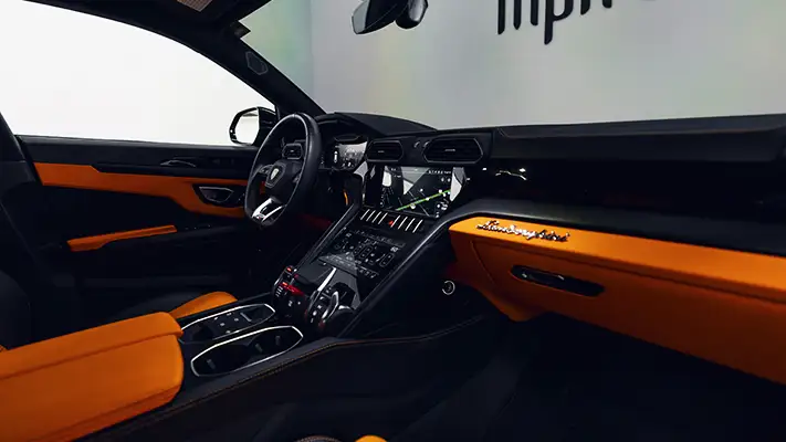 Grey on orange Lamborghini Urus for rent Miami interior view - mph club